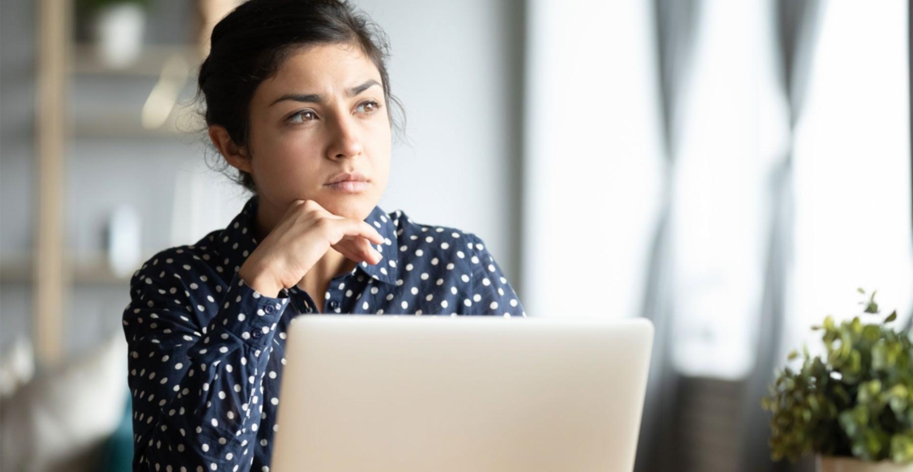 Business professional reviewing financial documents and analysis reports